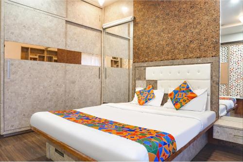 a bedroom with a bed in a room at Hotel Star Light - Near Jagtap dairy in Pune