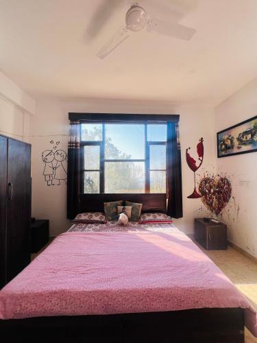 Ένα ή περισσότερα κρεβάτια σε δωμάτιο στο Park Homestay