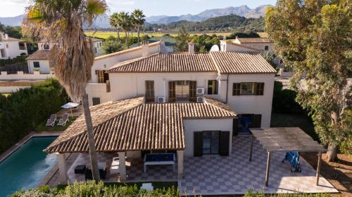 an aerial view of a house with a swimming pool at Beach House Llenaire in El Port