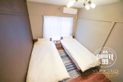 Кровать или кровати в номере Hakone 8mins walk-campingstyle FreeNetflix Switch 104