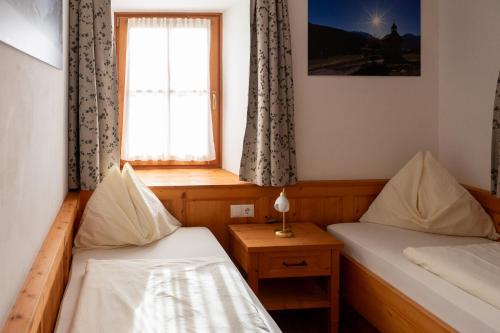 Postel nebo postele na pokoji v ubytování Hirschenhof