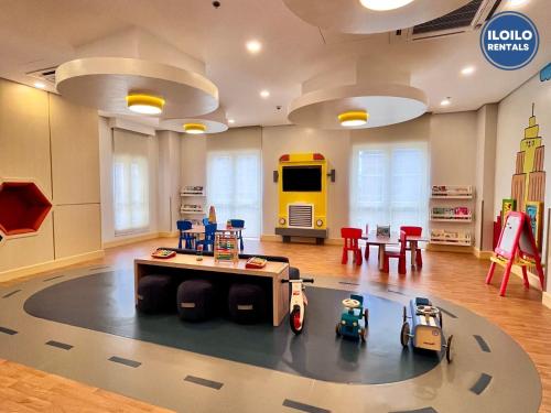 a living room with a lego room with two toy cars at Minimalist Studio in Saint Dominique in Iloilo City