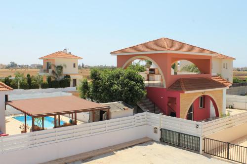 a view of the roof of a house with a swimming pool at Wealthystays 3BR Terrace BBQ Villa with pool in Liopetri