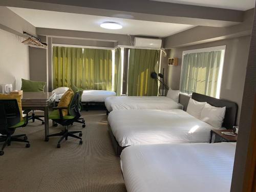 Ein Bett oder Betten in einem Zimmer der Unterkunft Shiki no Sai Asakusa