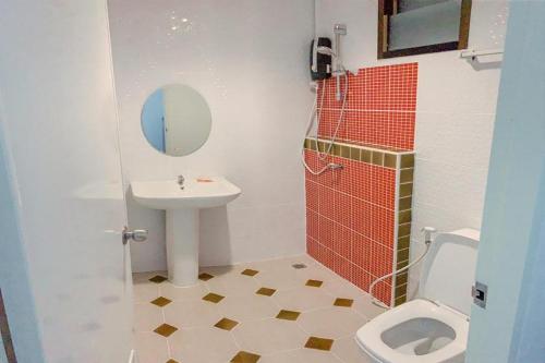 a bathroom with a sink and a toilet at Pai Tawan Resort Hotel - Pet friendly in Khon Kaen