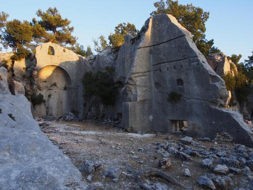 an old building on the side of a mountain at Beymelek Tas Evler in Demre