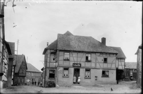 a black and white photo of a large house at Landgasthaus Pfahl in Wershofen