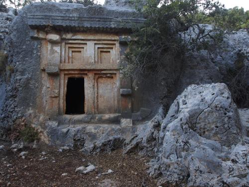 an old building on the side of a mountain at Beymelek Tas Evler in Demre