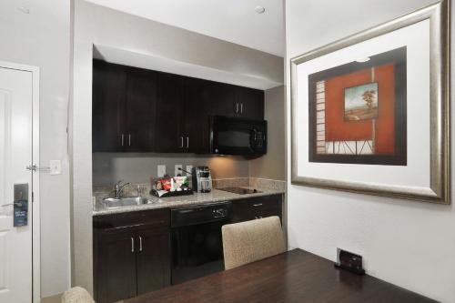 a kitchen with a sink and a counter top at Homewood Suites by Hilton Bel Air in Riverside
