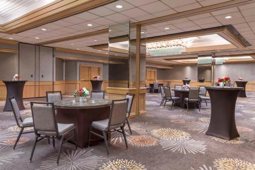 a conference room with tables and chairs in it at Hilton Orange County/Costa Mesa in Costa Mesa