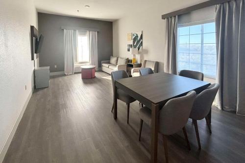 a living room with a dining room table and chairs at Comfort Inn & Suites Burnet in Burnet