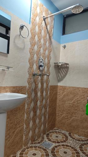 a shower with a skull head in a bathroom at Hotel Mystic Kakani in Kakani