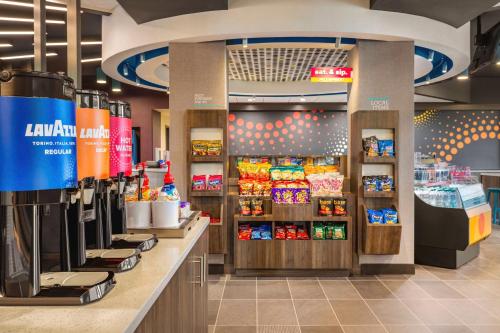 a store with a counter with food on it at Tru By Hilton Lodi in Lodi