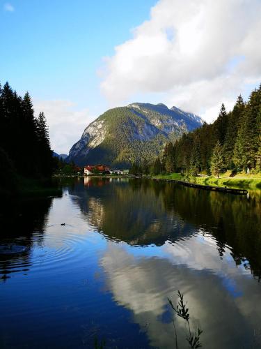 a view of a lake with a mountain in the background at Vollmond -406- in Ahrn