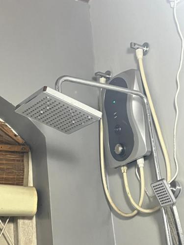 a wall with a hair dryer attached to a wall at Bellissimo Escape in Elpitiya