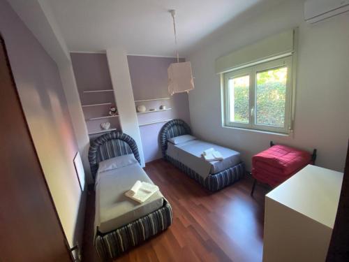 Postel nebo postele na pokoji v ubytování Il Vicolo House Nicolosi