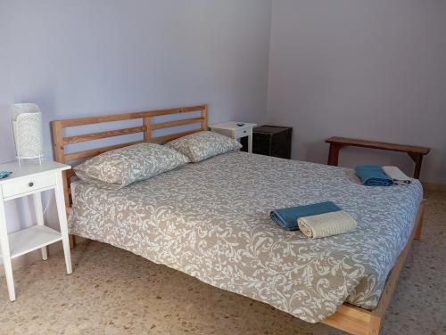 a bedroom with a bed with two pillows on it at Famiglia nel vento in Caramanico Terme