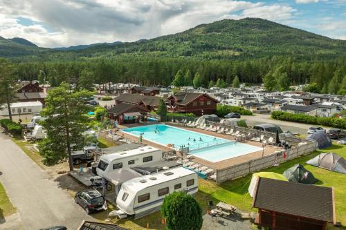 an rv park with a pool and a resort at First Camp Bø - Telemark in Bø