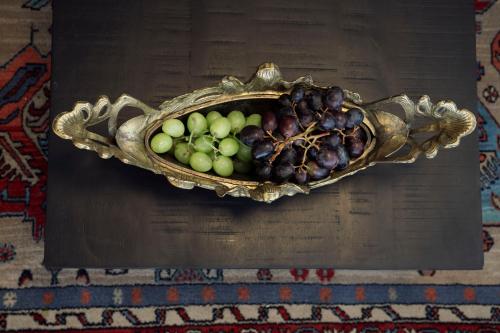 a bowl of fruit sitting on top of a table at מלון רמב"ן ירושלים - קבוצת מחניודה in Jerusalem
