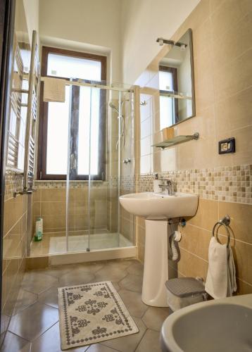 a bathroom with a sink and a shower at Bed and Breakfast Station in Brindisi