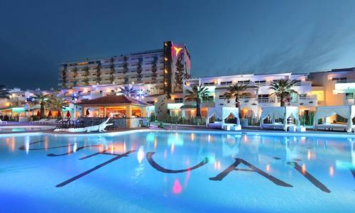 a large swimming pool in front of a hotel at Apart Ibiza Close to Hi & Ushuaia SEA FRONT in Illes Balears