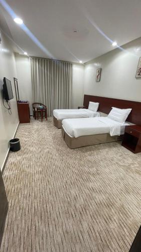 Postel nebo postele na pokoji v ubytování Kol Alayam Hotel