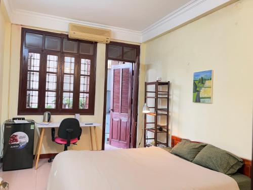 Postel nebo postele na pokoji v ubytování Tropical land little Hanoi homestay