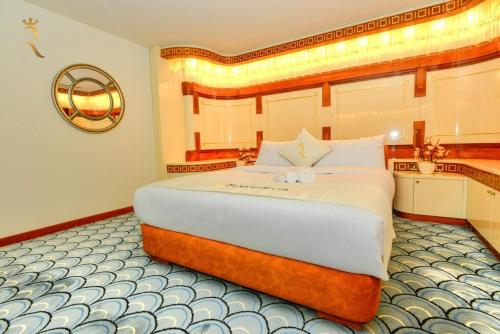a large bedroom with a large bed in a room at Timeless Elegance - Italian-Style Penthouse Retreat Near Corniche & WTC Mall in Abu Dhabi