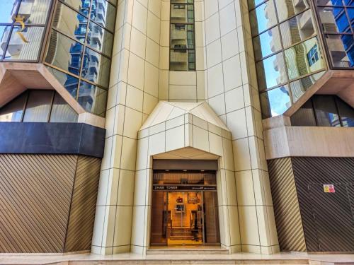 an entrance to a building with a hallway at Timeless Elegance - Italian-Style Penthouse Retreat Near Corniche & WTC Mall in Abu Dhabi