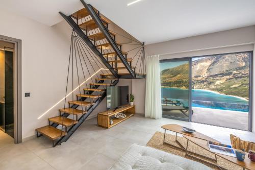 a living room with a spiral staircase and a large window at Avithos - Lassu Retreat in Zóla