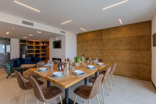 a dining room with a large wooden table and chairs at Villa Laura in Atri