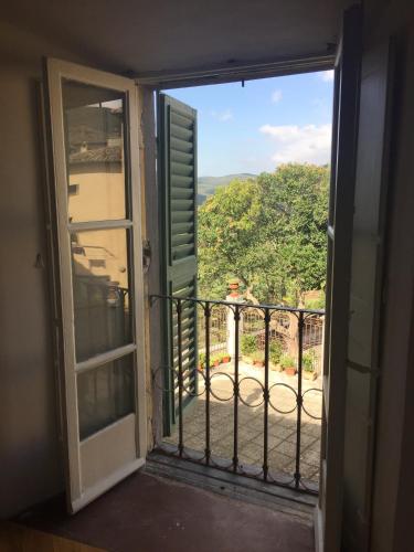 an open door to a balcony with a view at La Corte Di Alice in Lugnano in Teverina