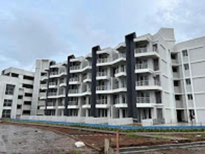 a large white apartment building with a parking lot at Ivy Bliss Studio with Common Pool, B 10, Karjat in Karjat