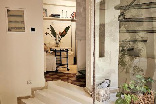 a hallway with a mirror and stairs in a room at Evangelia1 Comfortable room, Exquisite View in Athens