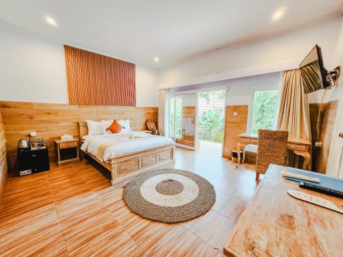 Postel nebo postele na pokoji v ubytování Agung Wiwin Homestay & Restaurant