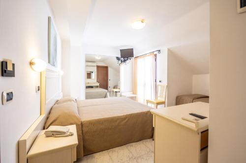 Ένα ή περισσότερα κρεβάτια σε δωμάτιο στο Hotel Florence
