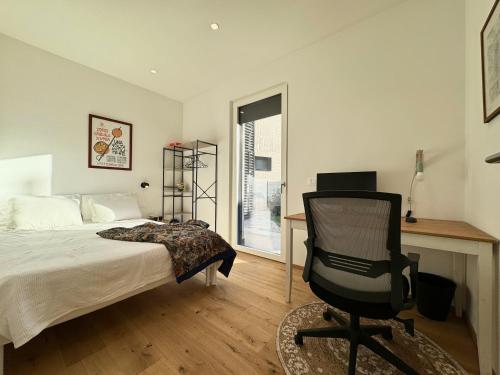 a bedroom with a bed and a desk and a chair at Borgo Garda in Peschiera del Garda