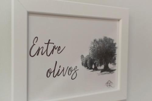 a picture of a framed picture of a tree at Vivienda Turística CASA QUEVEDO in Úbeda