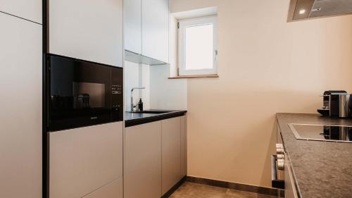 Dapur atau dapur kecil di Hofgut Apartment & Lifestyle Resort Wagrain