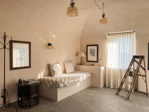 a bedroom with a bed and a ladder in it at Casa Rosalinda, Monferrato cozy apartment in Camino