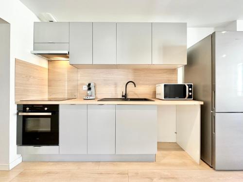 Kuchyň nebo kuchyňský kout v ubytování Le Reflet Doré - Familial - Spacieux - Central