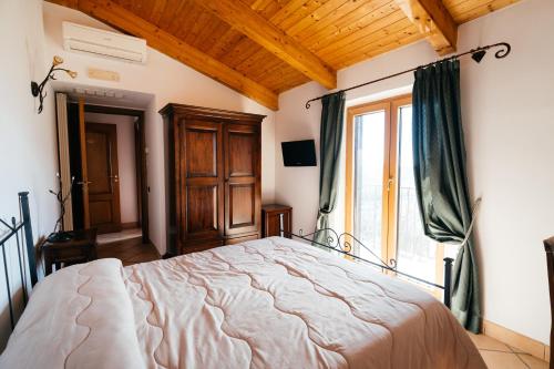 Ένα ή περισσότερα κρεβάτια σε δωμάτιο στο Villa Al Rifugio