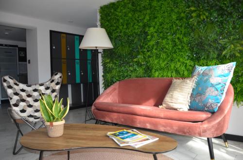 a living room with a couch and a table at Alma Candida 24 in Ganfei