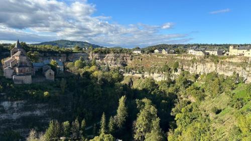 an aerial view of a town on a hill with trees at Maison avec magnifique vue et piscine privative in Saint-Félix-de-Lunel
