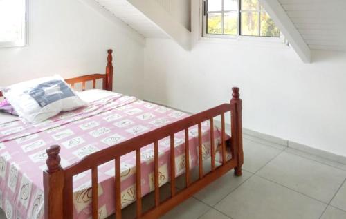 Postel nebo postele na pokoji v ubytování Appartement confortable à Capesterre, 40 m², jardin agréable