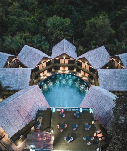 an overhead view of a swimming pool at a resort at A Coral Reefs Resort Langkawi in Kuah