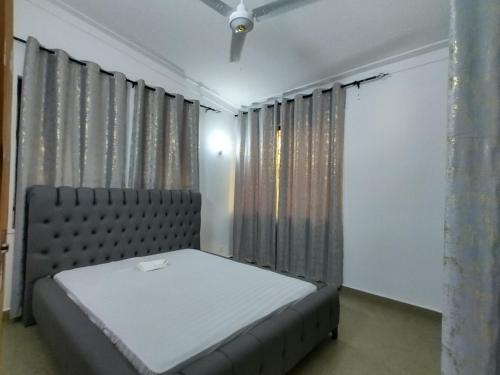 Ένα ή περισσότερα κρεβάτια σε δωμάτιο στο 3 Bedroom Villa, NYALI