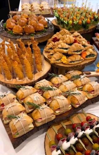 a bunch of plates of food on a table at Premium CGP Hotel Hoi An in Hoi An
