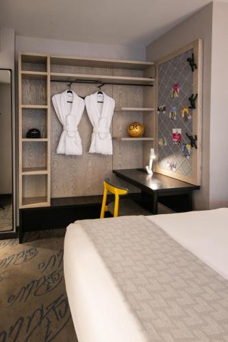 a hotel room with a bed and a table at Pestana CR7 Times Square in New York