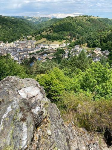 a rock on top of a hill with a town at Maison avec vue exceptionnelle et piscine privative in Saint-Félix-de-Lunel